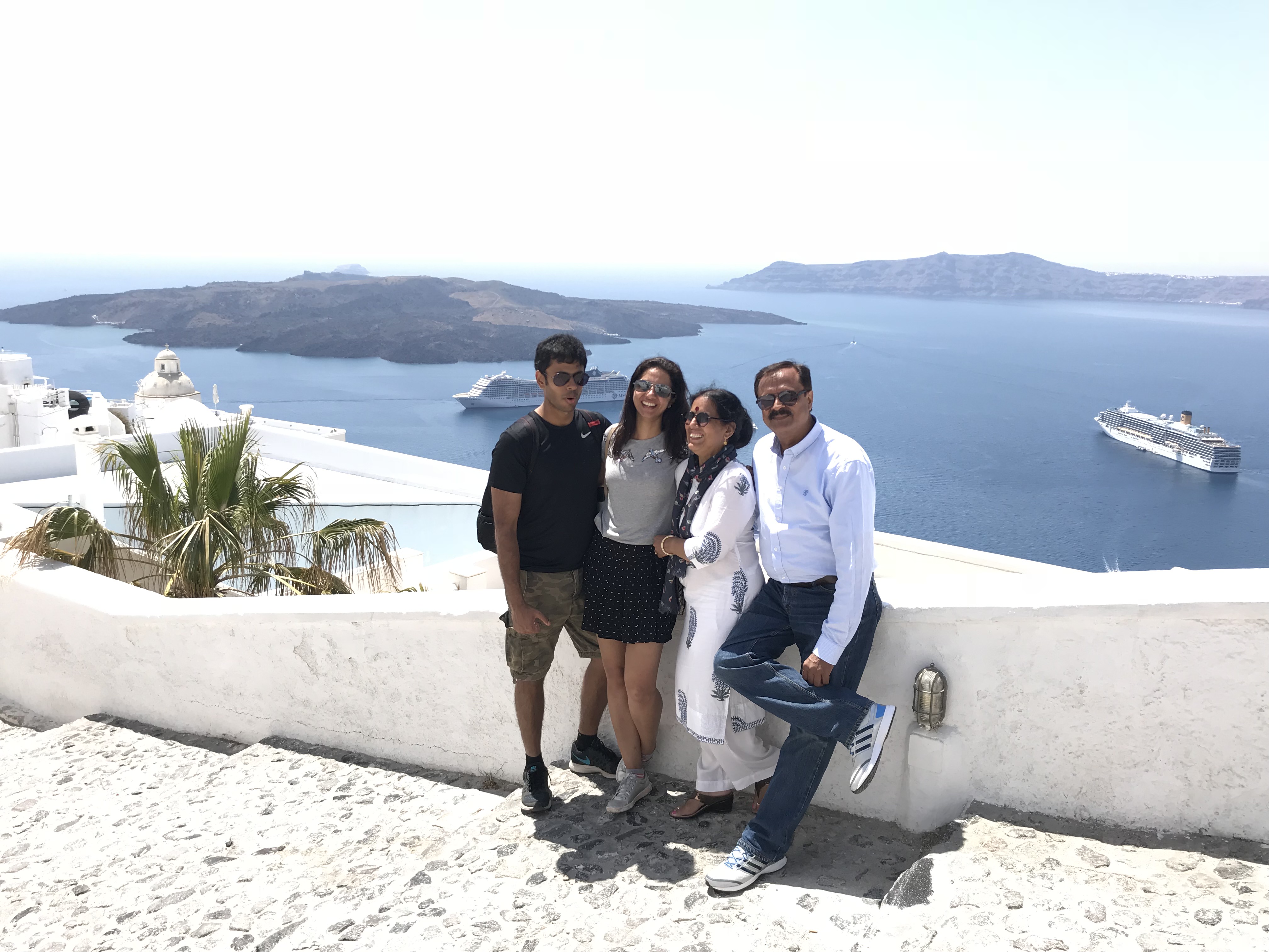 Dad with Mom, Harjyot and me in Santorini, Greece. (2018)